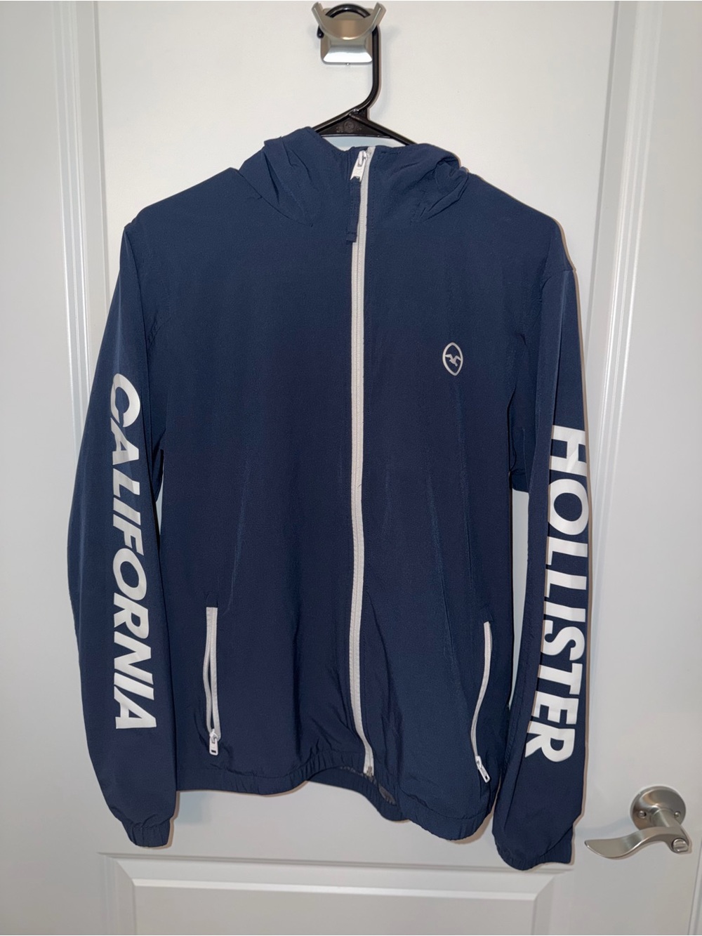 Hollister Navy Hooded Windbreaker with White Logo Panels